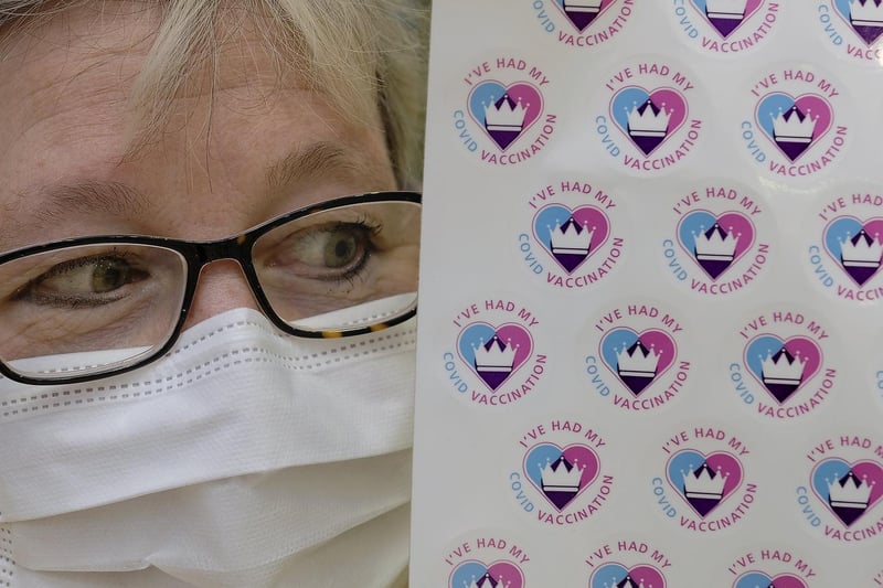 Dr Fiona Beardsley with Covid vaccination stickers.