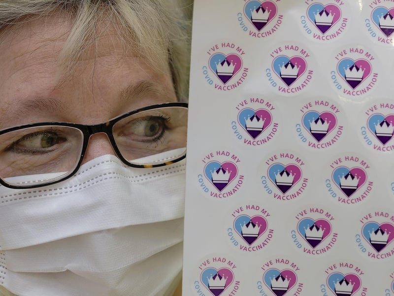 Dr Fiona Beardsley with Covid vaccination stickers.