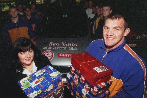 November  1999 and Hunslet Hawks captain Shaun Irwin (right) and the rest of his team joined Joanna Rollinson of Reg Vardy to launch the garage's 'Operation Christmas Child' Appeal.