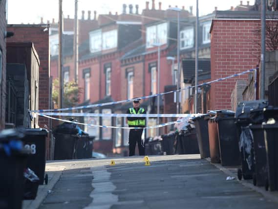 A policeman stands guard at a Leeds crime scene.