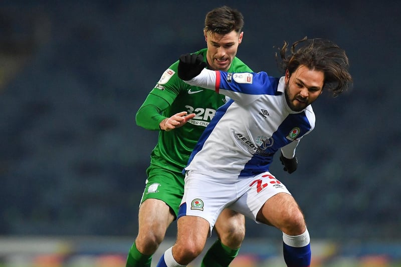Andrew Hughes challenges Bradley Dack at Ewood Park