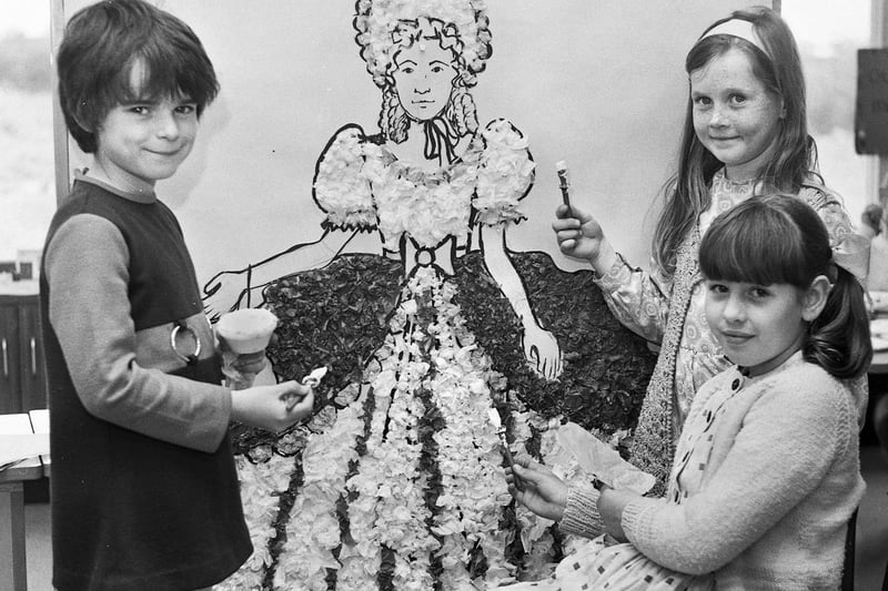 Pupils make a lady's crinoline dress, made from coloured paper at Birchley St Mary's RC primary school, Billinge, 1972.