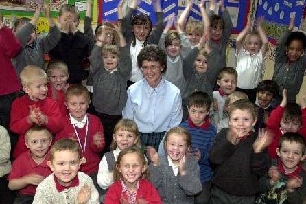 February 2003 and Pauline Bannister celebrates her long service award from Education Leeds with pupils at Raynville Primary after working as a teacher for 34 years.