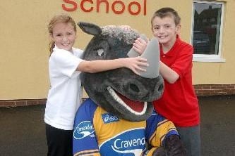 November 2003 and Ronnie the Rhino meets pupils Emily Dawson and Robin Miller at the opening of Summerfield Primary.
