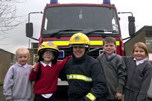 November 2003 and Raynville Primary pupils are pictured with  firefighter Dave Flynn as part of the school's Healthy School Week. They are Jade Bellas, Joseph Ryder, Patrick Moriarty and Rebecca Roberts.