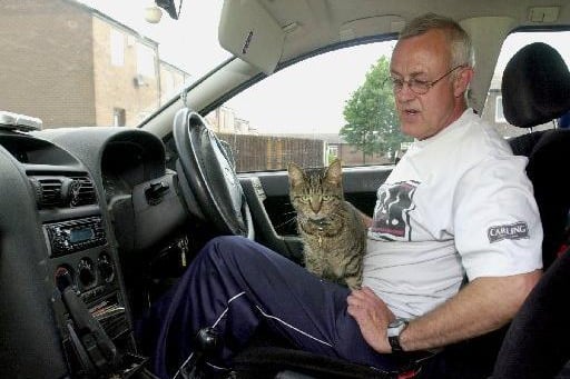 This is Kim Senior with his cat Millie who he took everywhere with him such as the shops, bank, walking and out driving in Bramley.