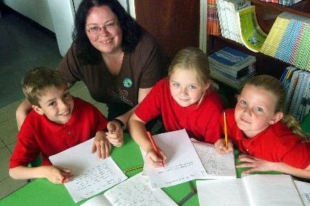 July 2003 and Emmerdale script writer Lisa Holdsworth visited Raynville Primary. She is pictured with pupils, from left, Joe Hall, Emily Hill and Charlotte Sizer.