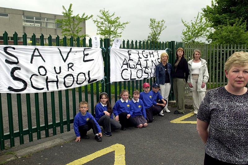 May 2003 and plans to merge Aireview Primary and Summerfield Primary sparked protests. Pictured is Aireview parent governor Judith Monaghan with parents and pupils.