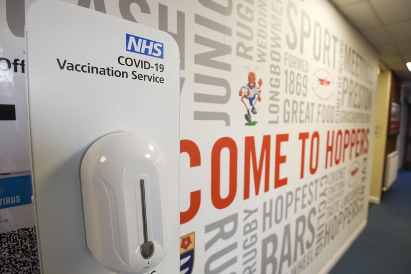Automatic hand sanitizing stations are positioned around the centre