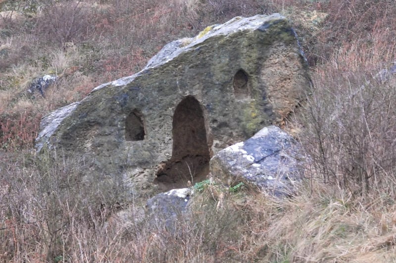 Hairy Bob's Cave. The huge boulder, carved with a door and windows, stands on Marine Drive in the shadow of the castle headland and has long been an object of fascination. But its origins are uncertain.