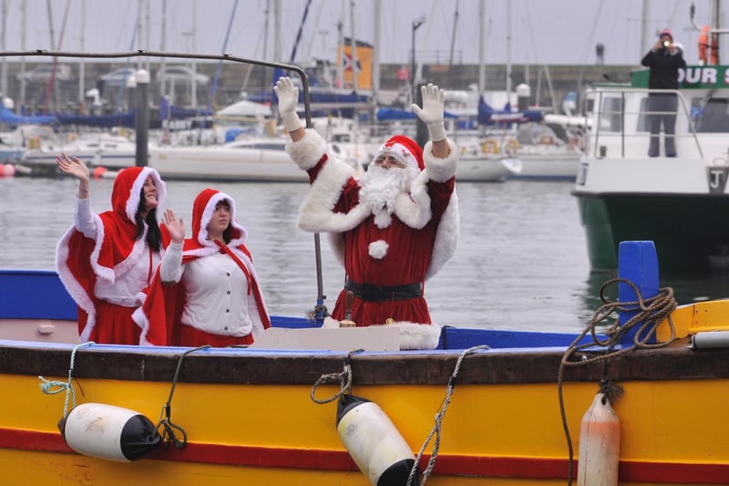 Santa's arrival by boat in the harbour. There would then be a procession up Eastborough before he took up residence in his grotto at Boyes.