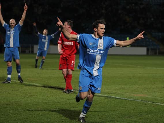 Lee Gregory scores for Halifax Town in the game against Kendal Town