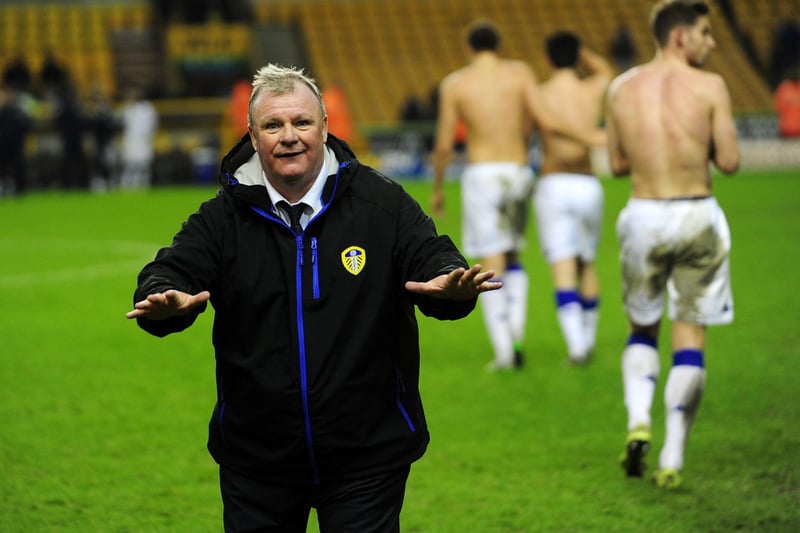 Head coach Steve Evans celebrates with Leeds United fans at full-time.
