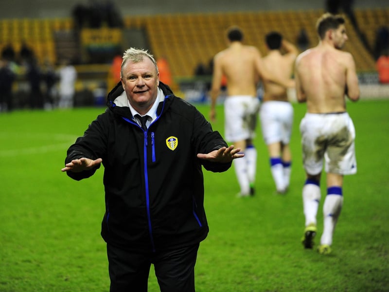 Head coach Steve Evans celebrates with Leeds United fans at full-time.