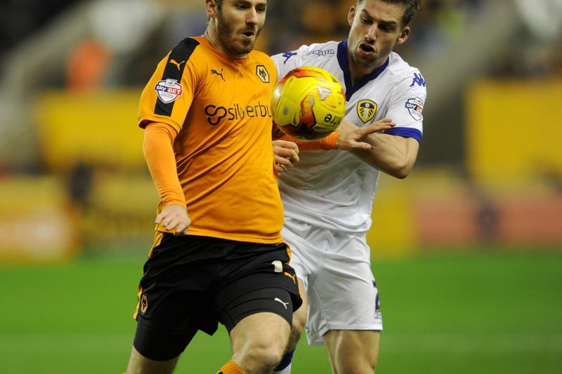 Charlie Taylor battles with Wolves midfielder James Henry.