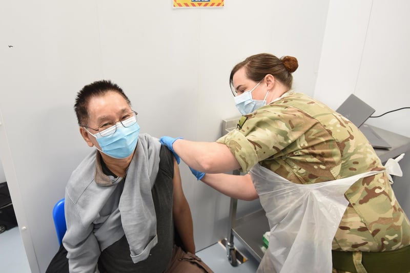 Yam Yau Wong is vaccinated by Sgt Jess Worth