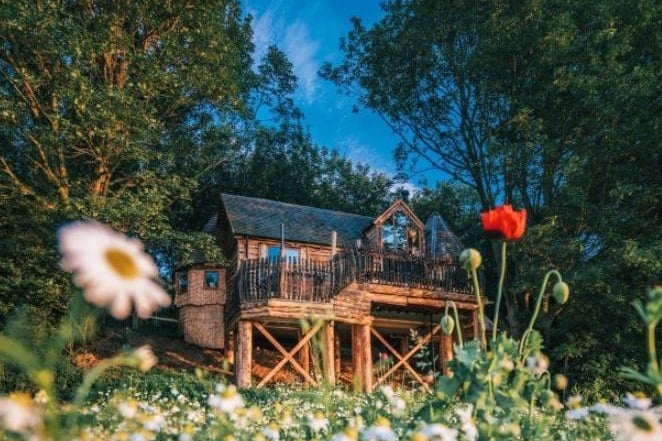 A luxurious family treehouse, privately secluded in medieval woodland with incredible views of the North Yorkshire Moors. It even boasts a den area - accessed by a slide - with a TV, movies, a games console and a popcorn maker. The three double bedrooms sleep six people.