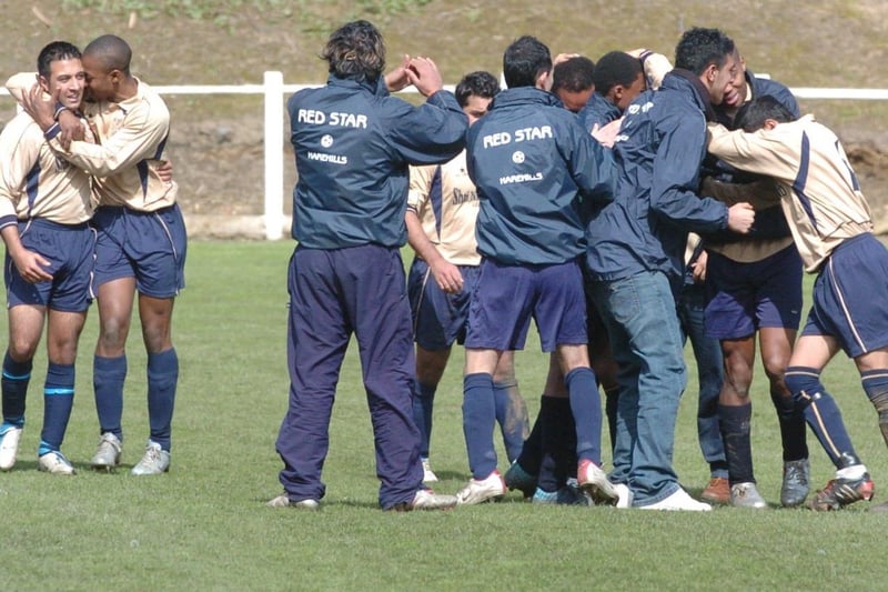 April 2005 and Red Star Harehills players celebrate Isaac Haywood's extra time goal against Roundhay in the Leeds Sunday League Presidents Cup Final at Bracken Edge.