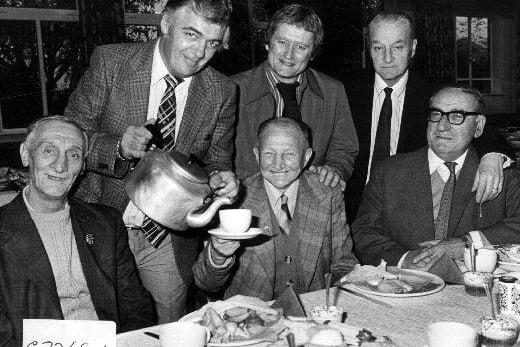 A press photograph of the Glass Houghton retired miners tea. 
On the back row, left to right are committee members Peter Hale, Mick Spence and Joe Graham. At the front from left to right are retired miners Joseph Thomas, Richard Morgan and Edward Devonshire