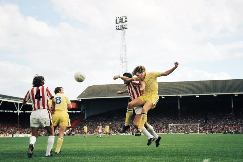 Gordon McQueen clears the ball during Leeds United's clash with Stoke City at the Victoria Ground in August 1974.