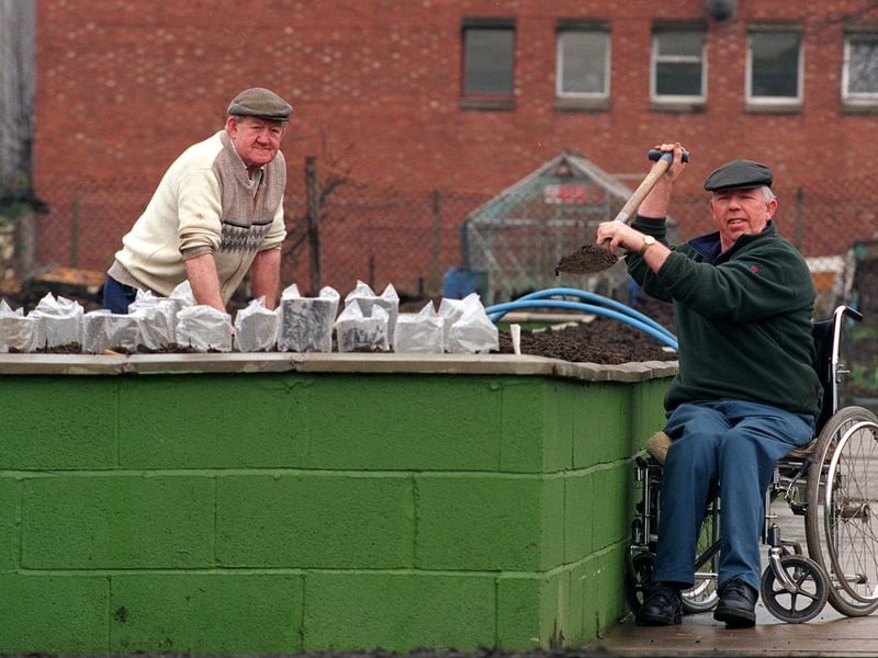 Green-fingered David Tallant uses a special plot for disabled gardeners at Clarke Field Allotments on Dewsbury Road. He is watched by John Robinson.