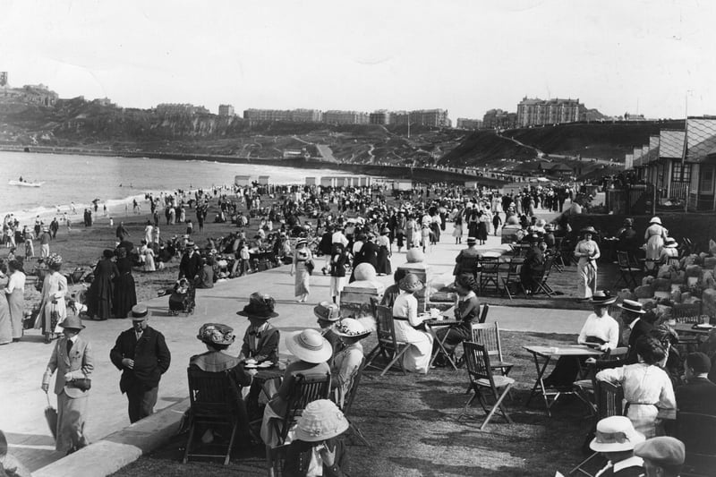 1913: Crowds of promenaders and onlookers out on the Scarborough sea front.