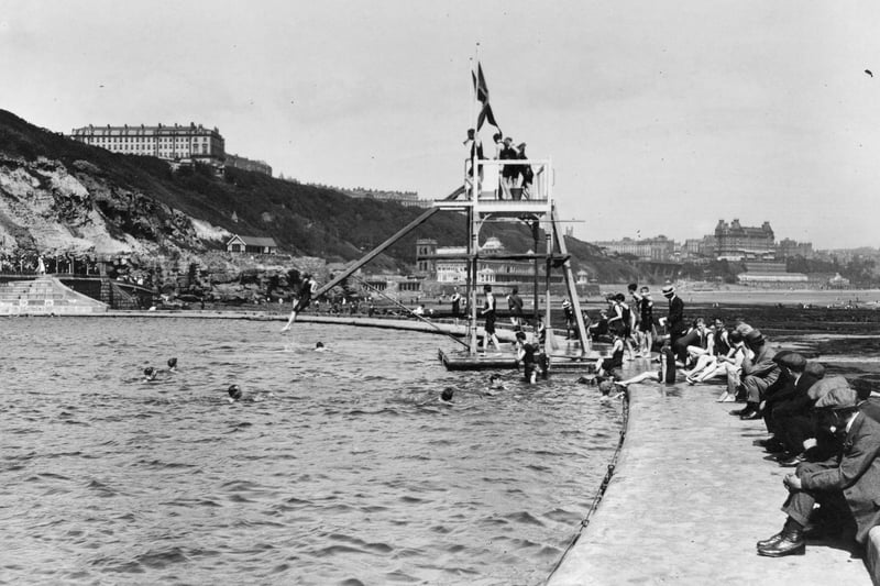 circa 1917: The diving board at the bathing pool at the South Cliff, Scarborough, Yorkshire.