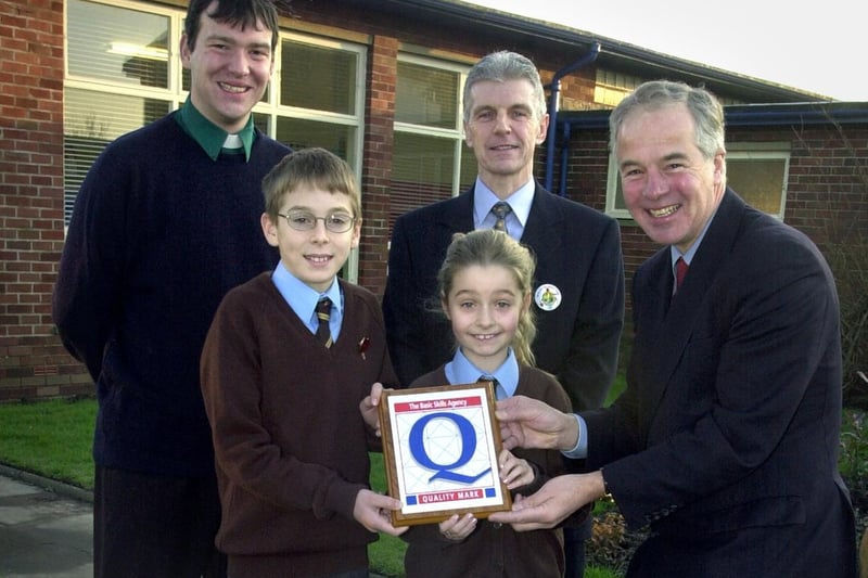 Fylde MP Michael Jack presented a government Quality Award to Freckleton CE School. Pictured, left to right: Chairman of Governors Rev Michael Gisbourne, Adam Roberts, 10, Emily Wignall, 11, school head Gary Worthy and Michael Jack