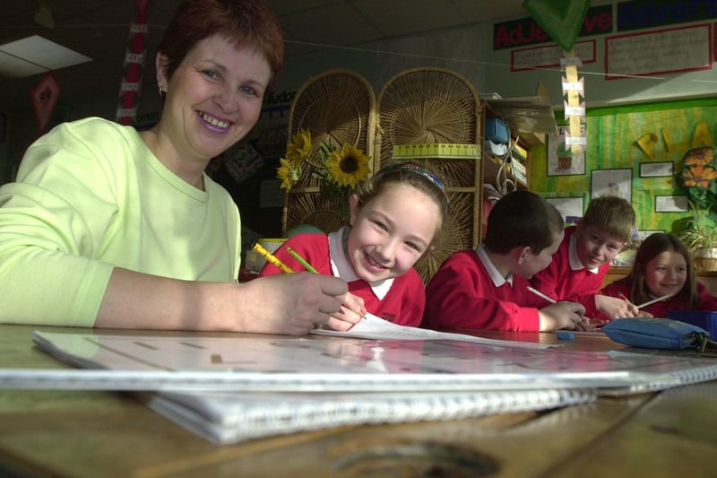 Diane Draper and her daughter Natalie, eight, at Howick CE Primary School, in Penwortham, near Preston. Diane is taking part in the back to school scheme, so they can learn how to help their children