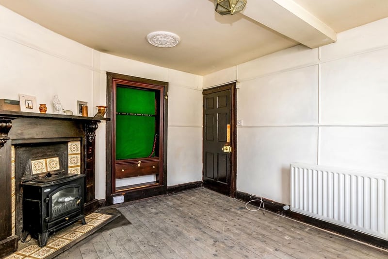 The separate sitting room was used as a hobby room by the previous owners. It has toughened glass windows, reinforced metal door and even a gun storage cabinet.