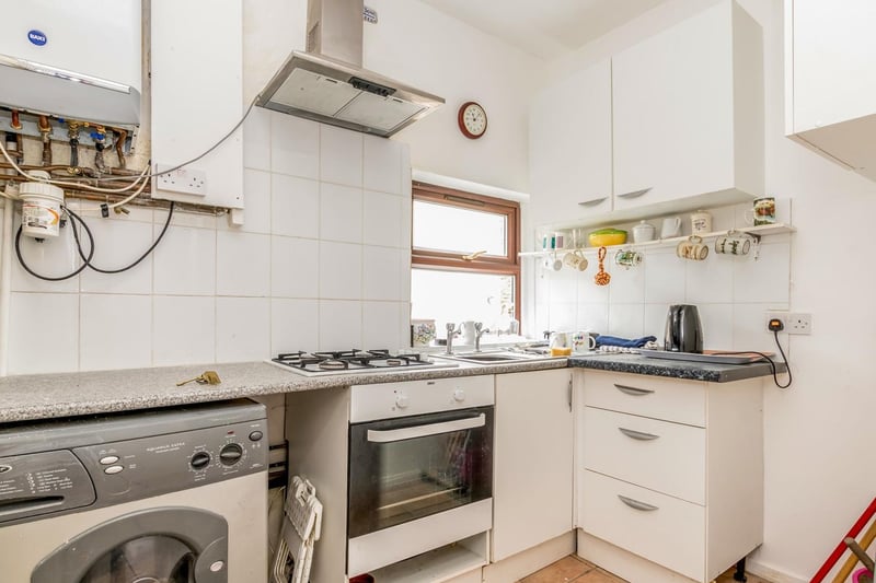 The fitted kitchen may need modernising but has a range of wall and base units including a gas hob, electric oven, plumbing for a washing machine, stainless steel sink with drainer, cooker hood and recently installed central heating boiler.