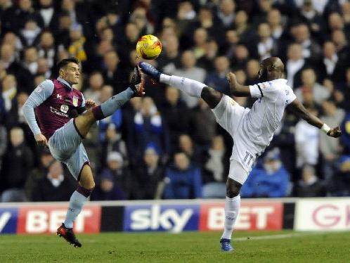 Souleymane Doukara goes toe to toe with Aston Villa's Ashley Westwood.
