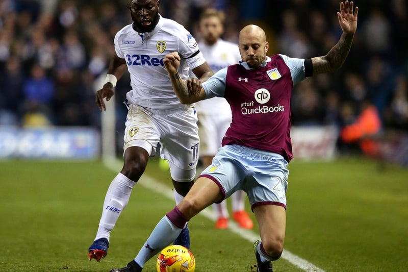 Souleymane Doukara and Aston Villa's Alan Hutton battle for the ball.