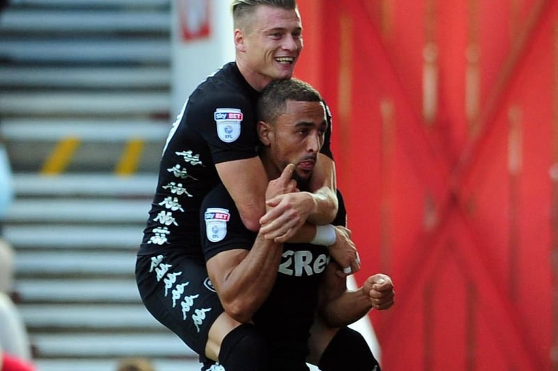 Kemar Roofe celebrates scoring against Nottingham Forest at the City Ground in August 2017 with Ezgjan Alioski.