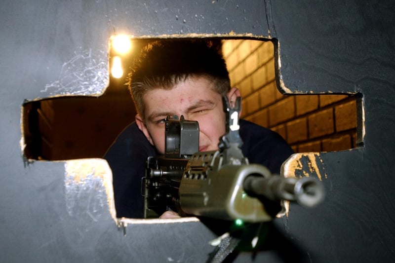 March 2004 and the RAF made a flying visit to Bruntcliffe High School. Pictured is  Jamie Coupland in the mobile indoor shooting range.