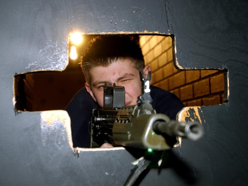March 2004 and the RAF made a flying visit to Bruntcliffe High School. Pictured is Jamie Coupland in the mobile indoor shooting range.