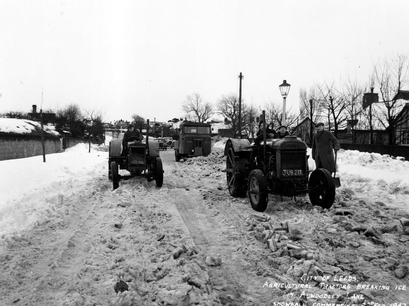 Agricultural tractors on Alwoodley Lane at Alwoodley breaking the ice in an attempt to clear the road. On the left the chimney of Moss Hall can be seen.