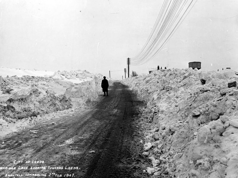 The depth of the snow can be seen here on Cookridge Lane. The water tower can be seen on the right. Tinshill Lane is just out of view on the right beyond the water tower.