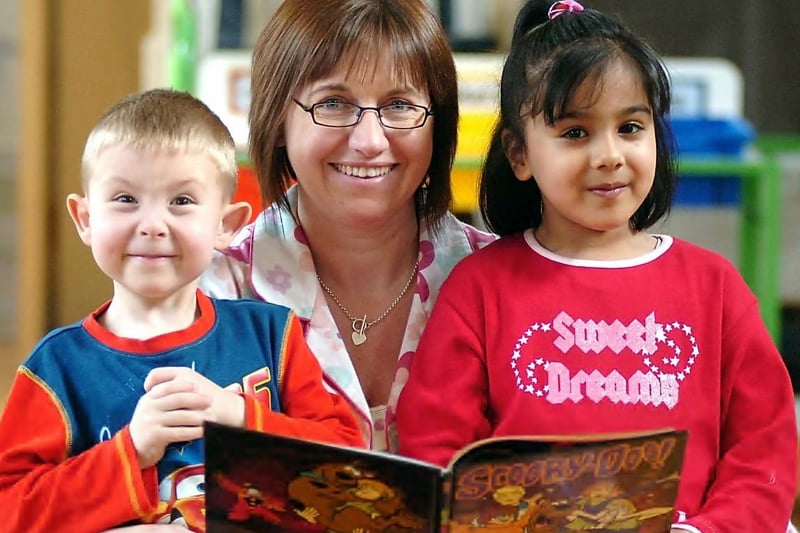 Pyjama event in 2008 - Teacher Heather Taylor with Year 1 pupil Suzy Hussain and Upper Foundation pupil Cy Tonks.