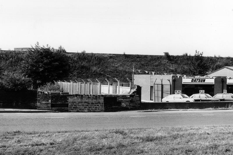 Stanningley Road showing P.K. Motors garage, a Datsun dealer in July 1983.