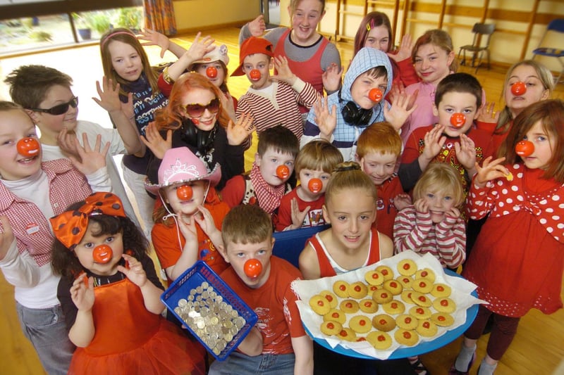 Youngsters at Hunmanby Primary School raise cash by buying red nose biscuits.