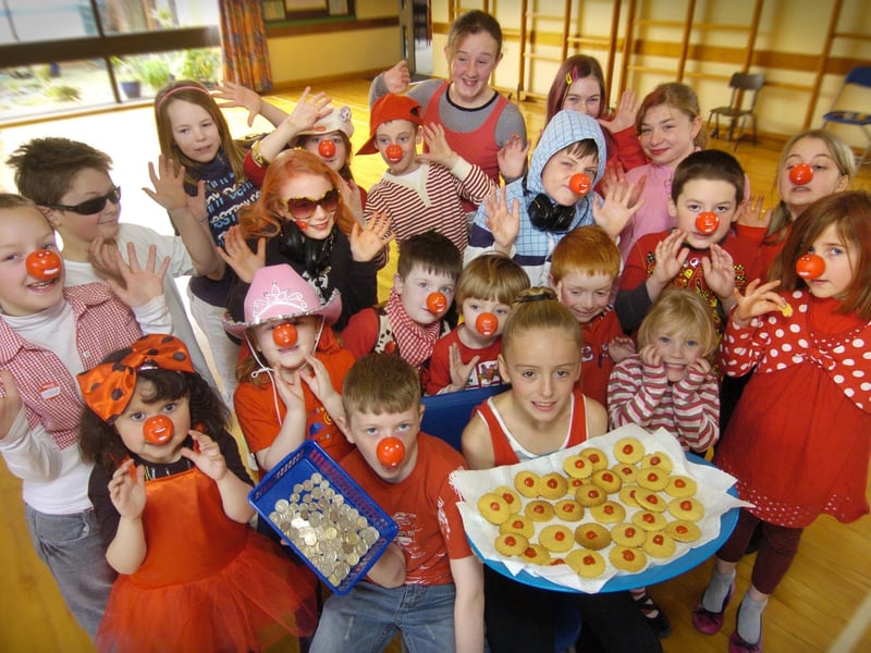 Youngsters at Hunmanby Primary School raise cash by buying red nose biscuits.