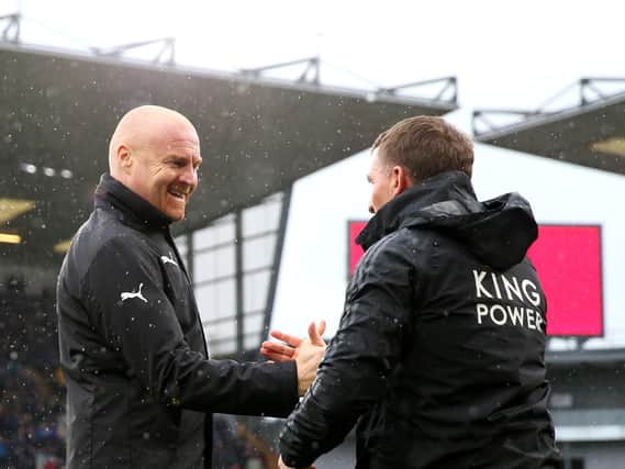Sean Dyche, Manager of Burnley shakes hands with Brendan Rodgers, Manager of Leicester City prior to the Premier League match between Burnley FC and Leicester City at Turf Moor on March 16, 2019 in Burnley, United Kingdom.