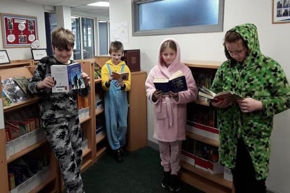 A bit of reading in their pjs for these pupils.