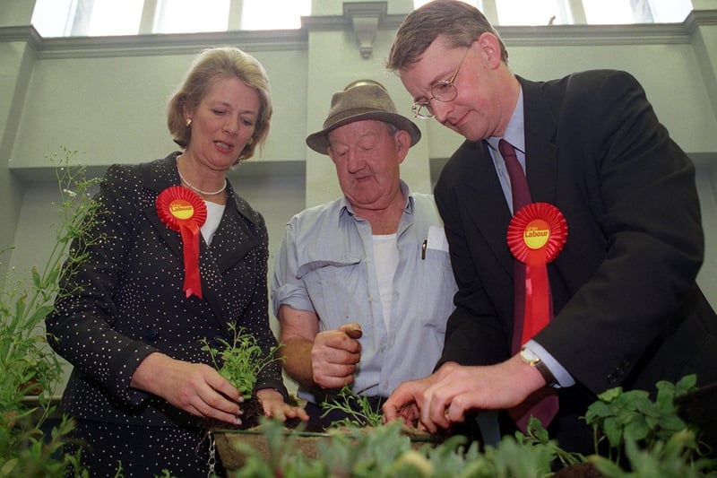 May 1999 and Leeds Central by-election candidate, Hilary Benn visited the launch of 'Beeston in Bloom' with Cabinet Minister Baroness Jay. They are pictured with local resident John Robinson.