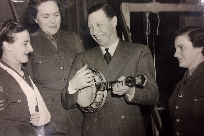 Although George Formby would refer to it as a ukulele, the instrument he mostly played was actually a banjolele – a kind of uke/banjo hybrid - pictured entertaining the troops.