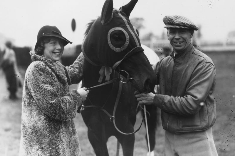 13th October 1938:  Comedian George Formby, who was previously a jockey, pictured with his wife and the horse 'Lucky Bert' which he will rode in a hurdle race and donated his fees to charity.
