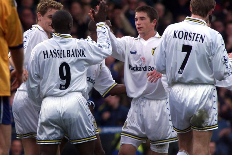 Jimmy Floyd Hasselbaink celebrates with his teammates after putting Leeds 2-1 ahead after 32 minutes.