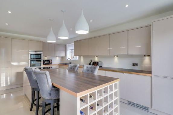 Situated on an enviable corner plot, the home has been extended and modernised throughout.The entrance hall opens onto a stunning kitchen with an island unit and integrated appliances.