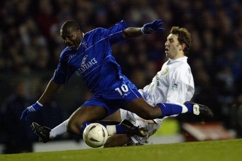 Jason Wilcox tackles Gillingham's Guy Ipoua during the FA Cup fourth round replay at Elland Road in February 2003. Leeds won 2-1.